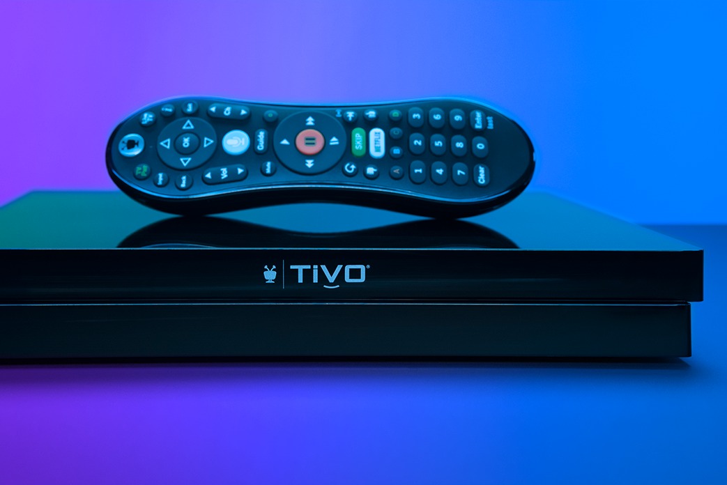 black TiVo EDGE for cable with remote sitting on top